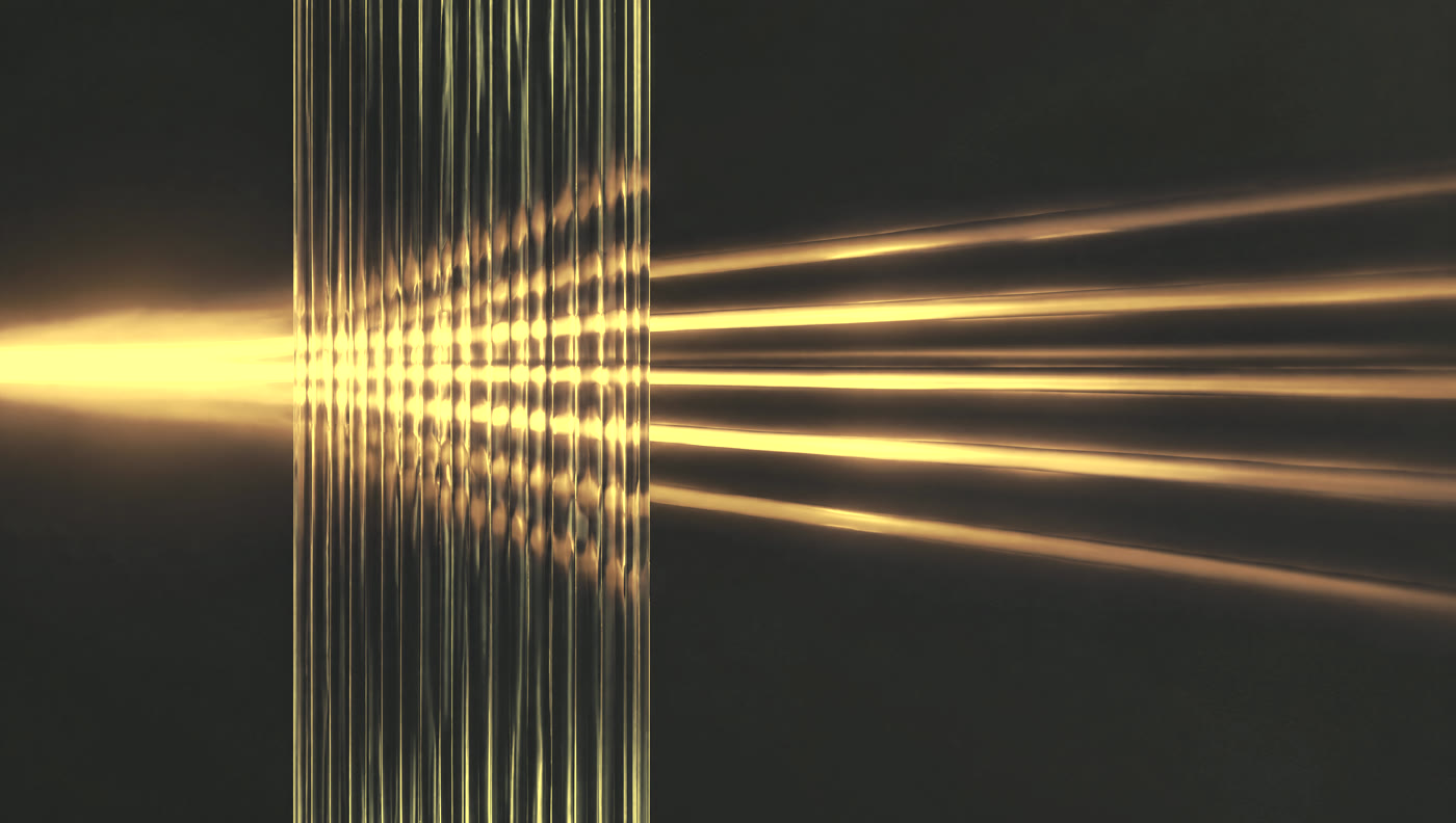 A wide band of warm light refracting through ribbed glass